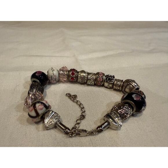 Brighton charm bracelet with 18 individual charms in silver metallic - Picture 2 of 2